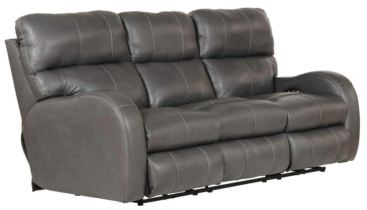 Gray leather sofa with reclining feature on a white background