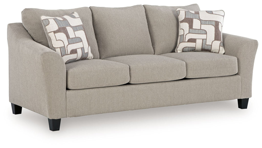 Gray sofa with patterned cushions on a white background